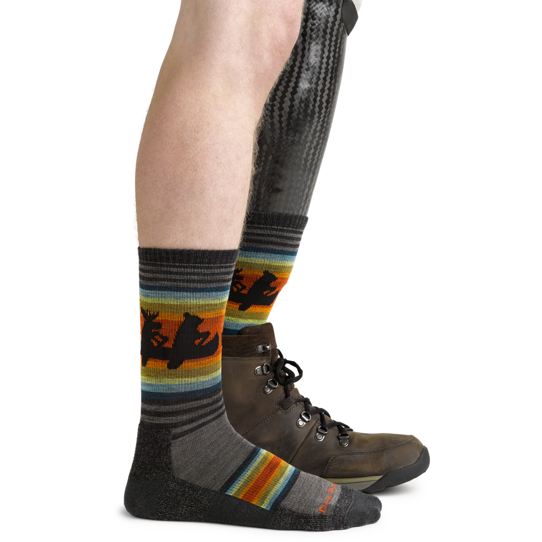 5003 men's Willoughby hiking socks with a canoeing bear and moose design in taupe brown on prosthetic foot with hiking boots