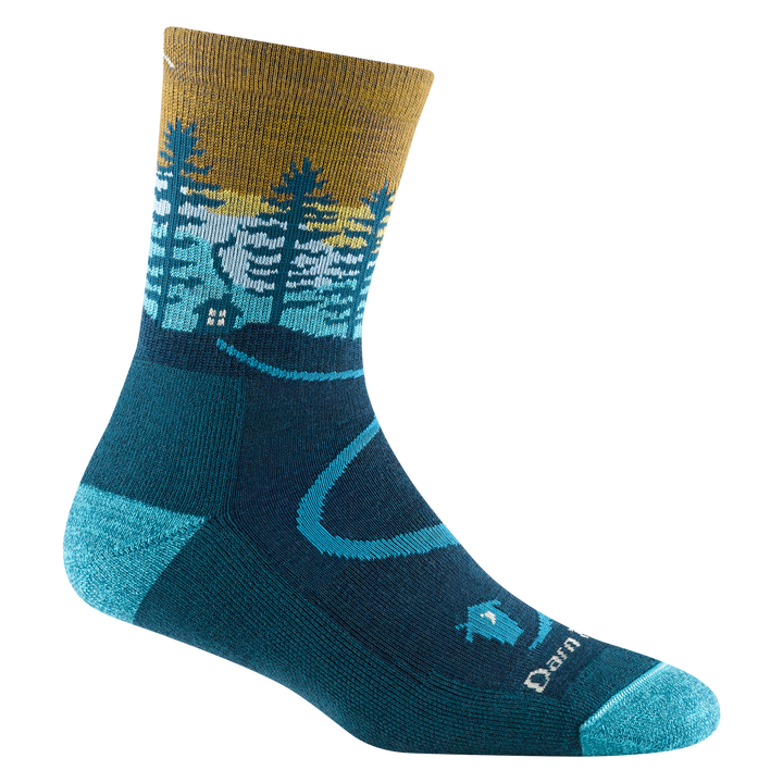 5013 women's northwoods micro crew hiking sock in dark teal with a blue toe/heel accents and cabin and tree design on the ankle