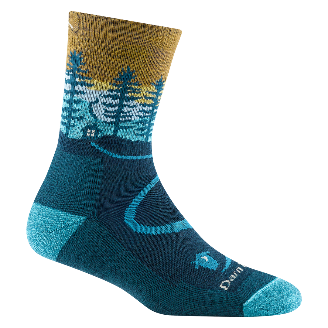 5013 women's northwoods micro crew hiking sock in dark teal with a blue toe/heel accents and cabin and tree design on the ankle