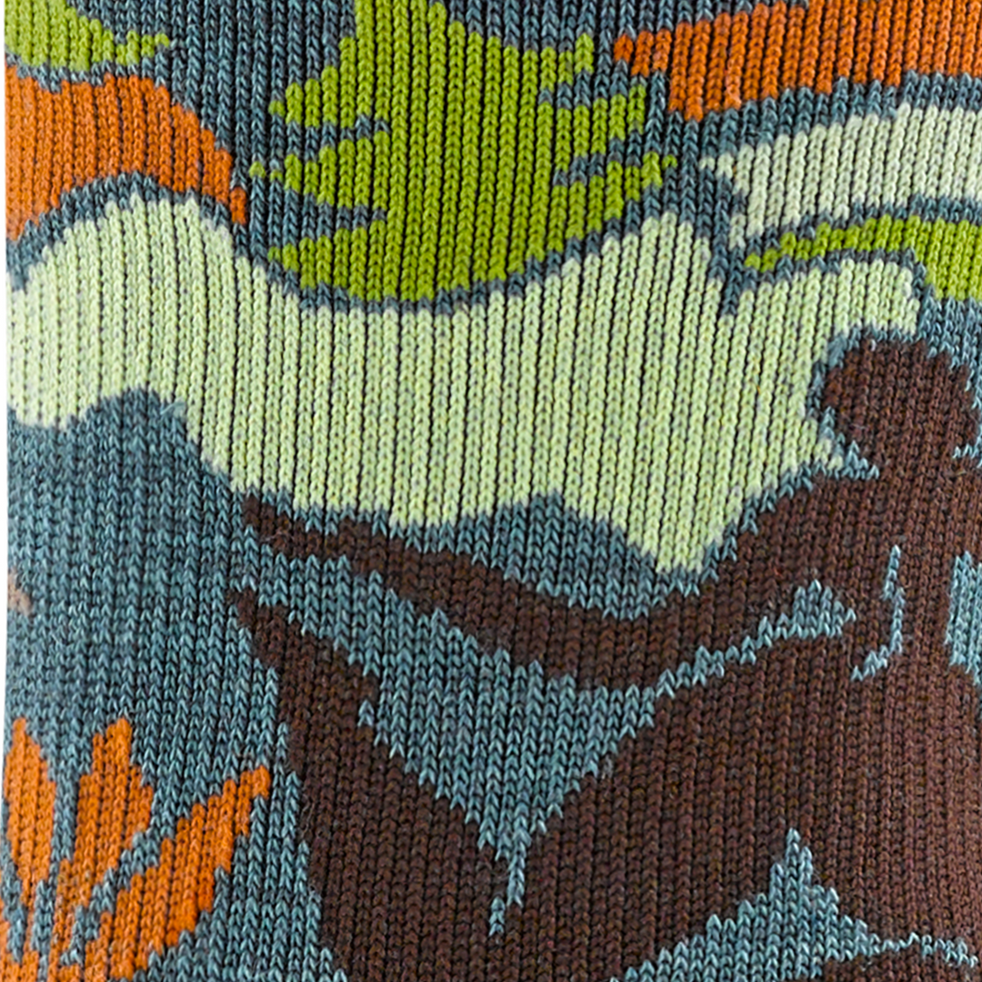 Call out detail image of the of the 5016 teal reverse image of women running in forest 