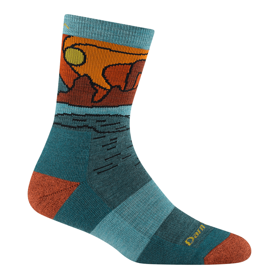 5023 Celeste micro crew in Teal featuring a blue body orange heel/toe and daytime canyon landscape on the ankle