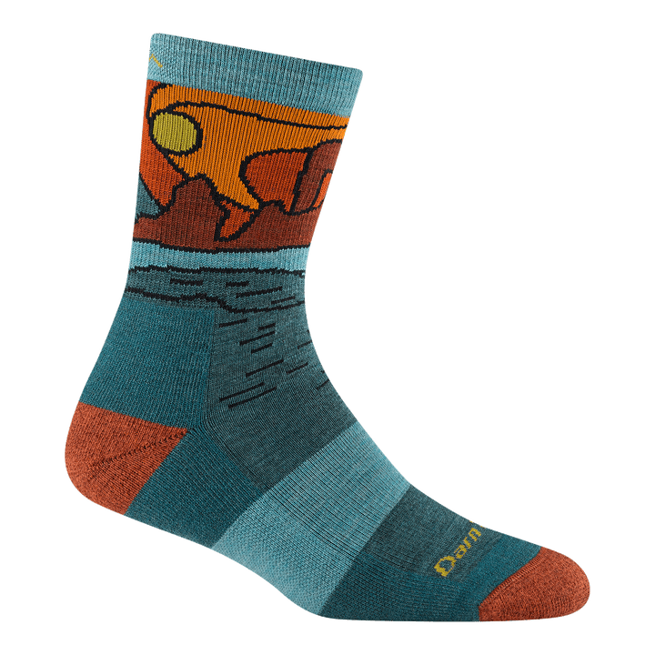 5023 Celeste micro crew in Teal featuring a blue body orange heel/toe and daytime canyon landscape on the ankle