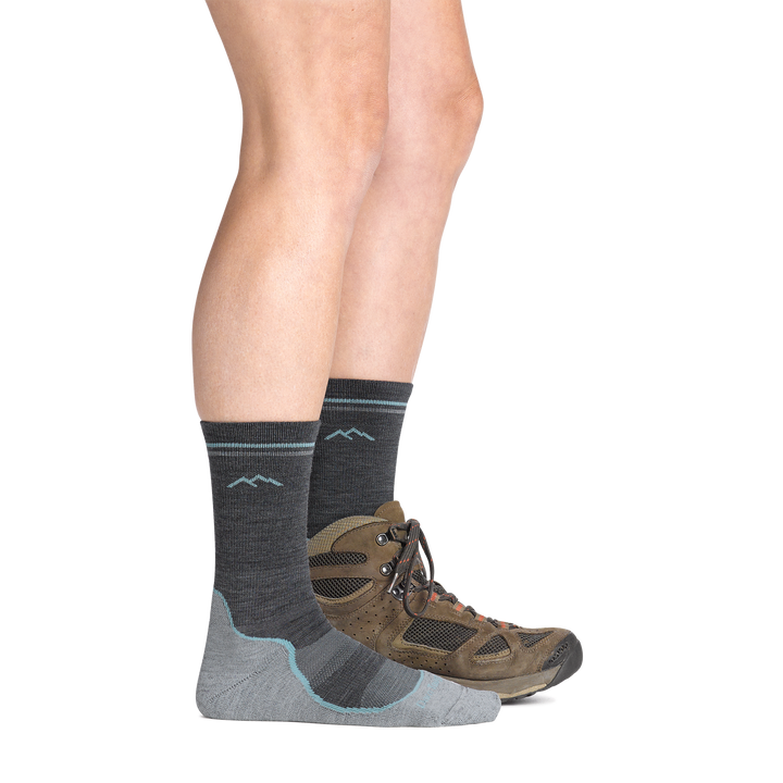 on model image with back foot in a hiking boot wearing the 5029  light hiker boot sock in slate gray colorway