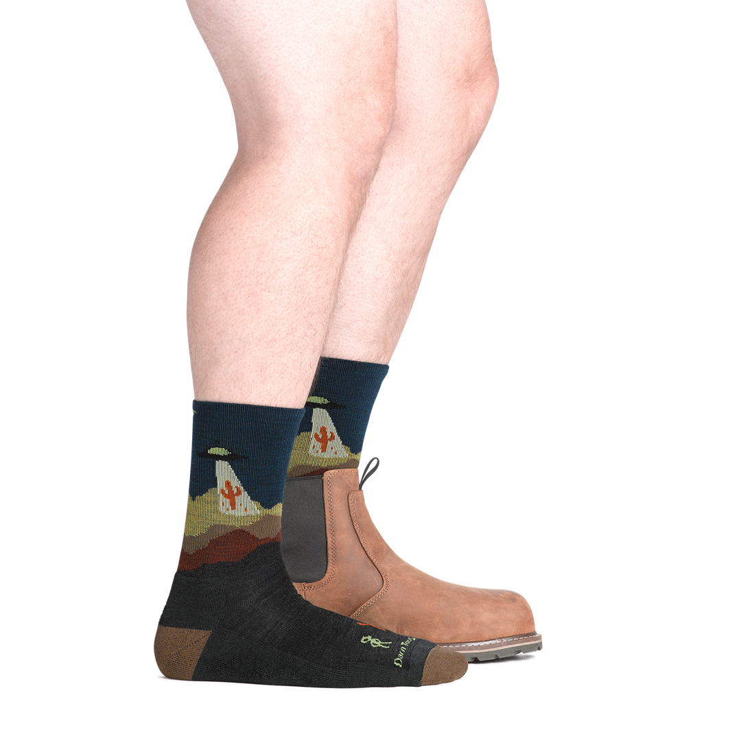 on model image with back foot in low cut boot wearing the spaced out micro crew hiking sock in charcoal colorway