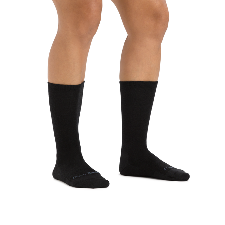 Image of a woman's legs on a white background wearing Women's Solid Basic Crew Lightweight Lifestyle Sock in Black