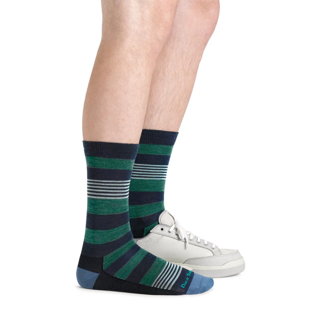 Profile of male legs wearing Oxford Crew Lightweight Lifestyle Socks in Eclipse, with back foot in a sneaker