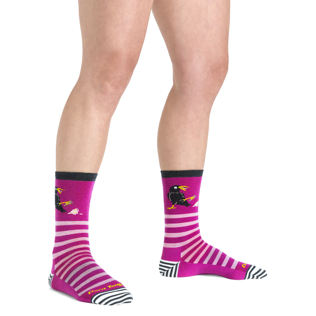  Close up shot of model wearing the women's animal haus crew lifestyle sock in clover with no shoes on