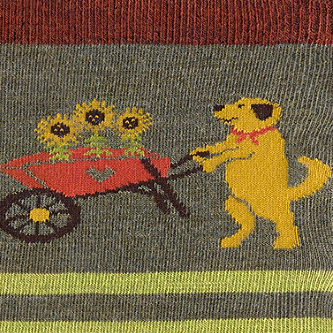 Call out detail image of the of the 6037 herb front image of dog pushing wheel borrow with flowers