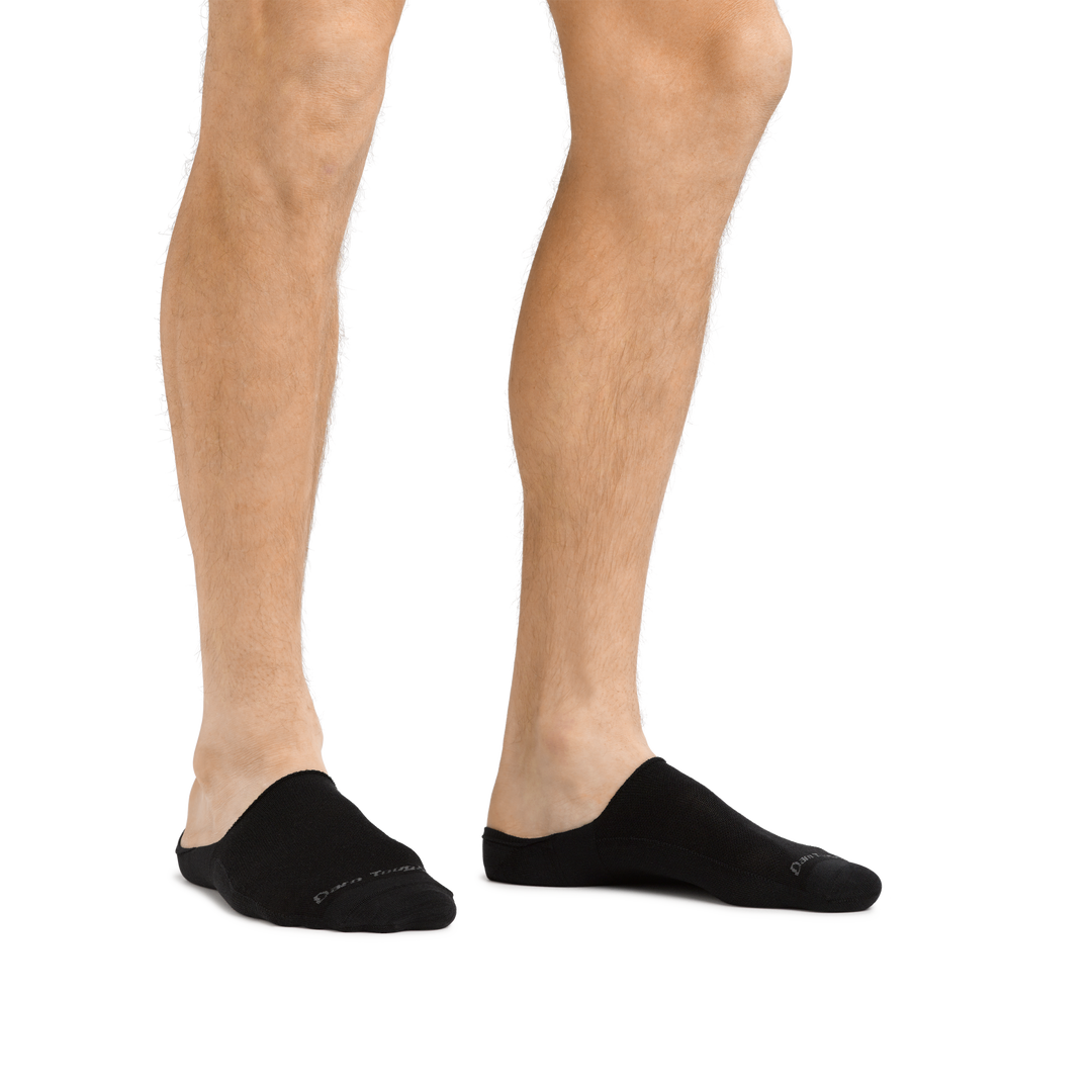 Man standing barefoot wearing Topless Solid No Show Hidden Lightweight Lifestyle Sock in Black