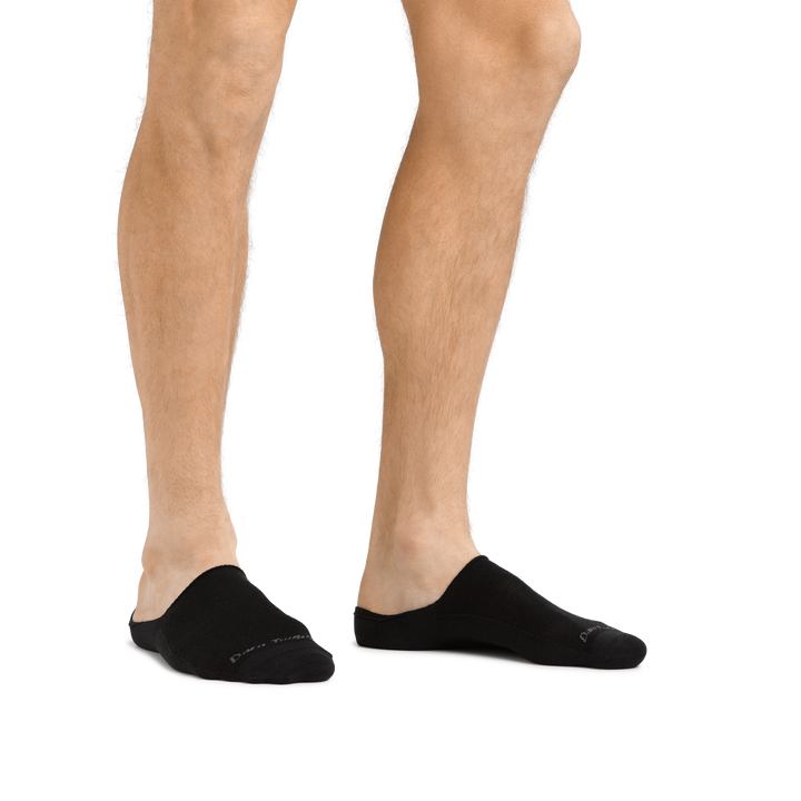 Man standing barefoot wearing Topless Solid No Show Hidden Lightweight Lifestyle Sock in Black
