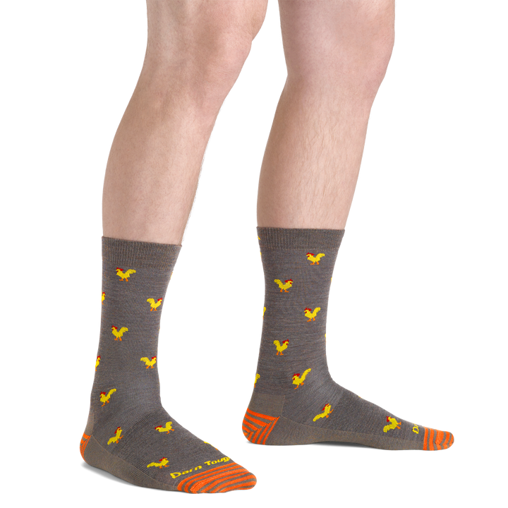 Man standing barefoot wearing Strut Crew Lightweight Lifestyle Socks in taupe