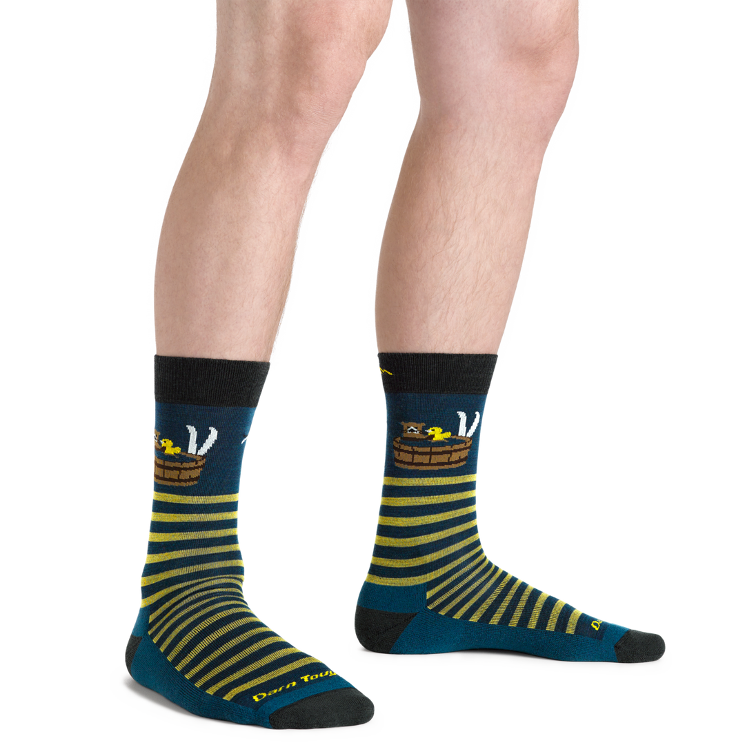 Close up shot of model wearing the men's wild life crew lifestyle socks in Drak teal with no shoes on