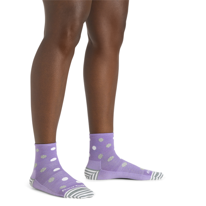 Close up shot of model wearing the women's dottie shorty lifestyle sock in lavender with no shoes on