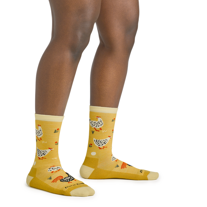 On model image of 6114 Mother Clucker Lifestyle socks in Sunny colorway featuring yellow body and white and black chickens