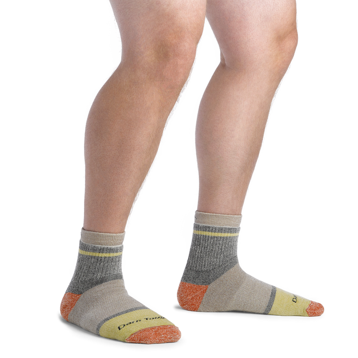 On model image of 6118 Men's Home Base socks in Rye colorway featuring tan, yellow, and orange accents