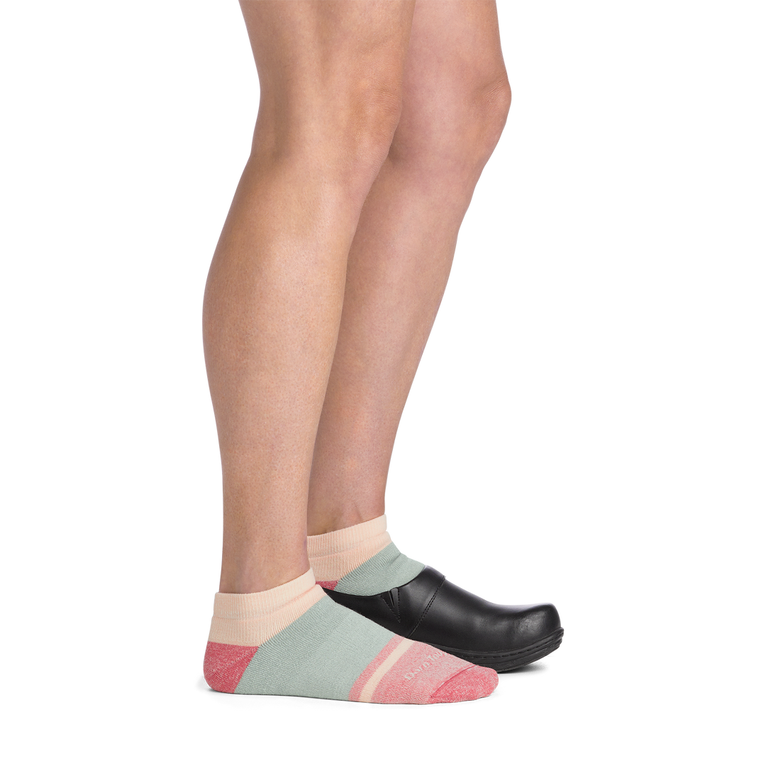 on model image side view back foot with clog on it wearing 6127 no show lifestyle sock in honeydew colorway