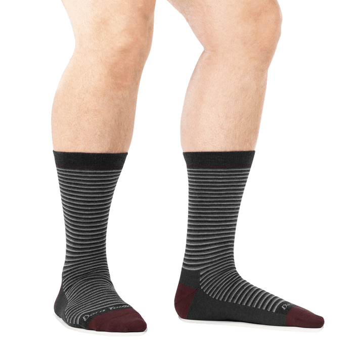 on model image of man barefoot in staggered stance wearing 6134 charcoal crew lightweight sock