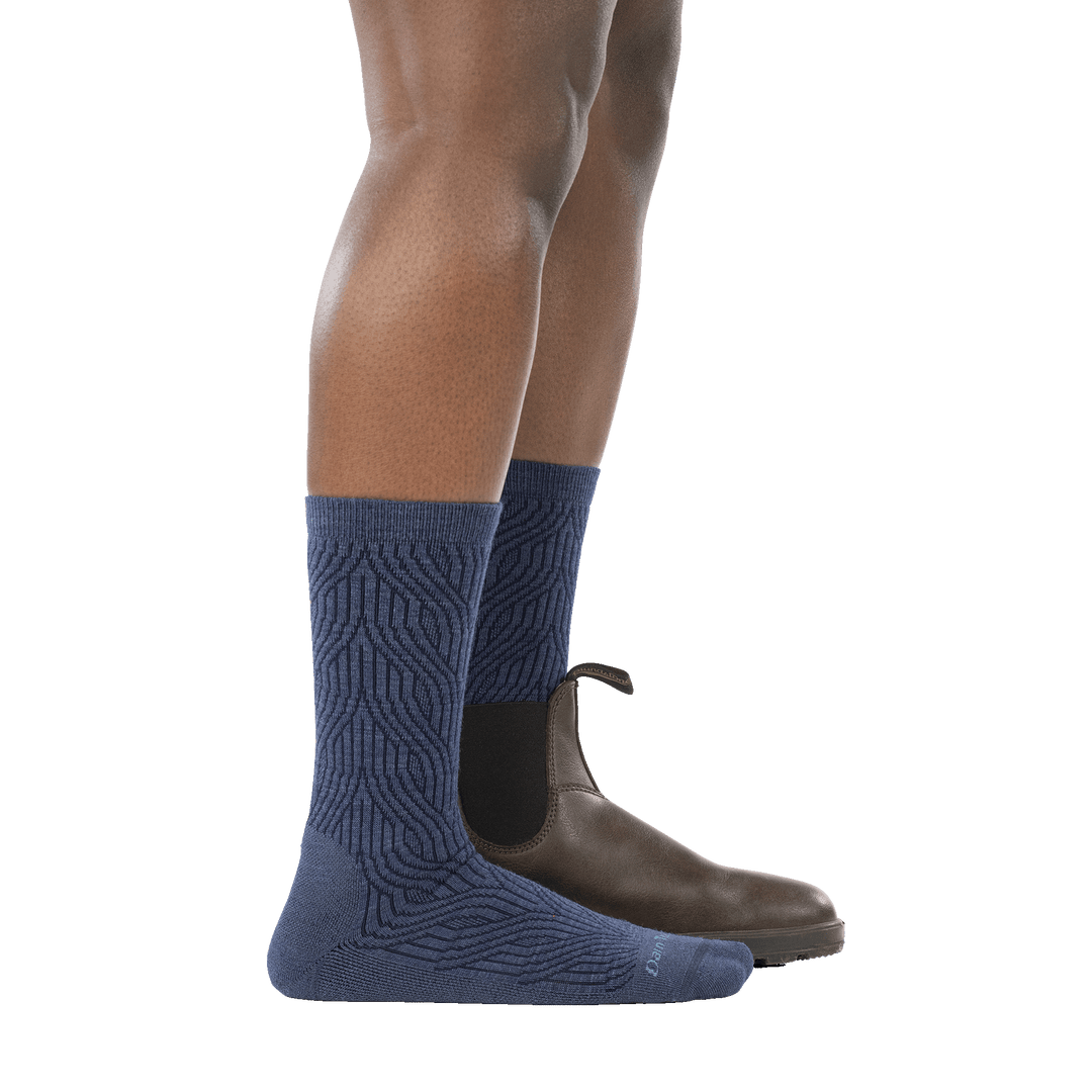 model wearing boot on back foot and 6140 denim lightweight crew sock with cushion side profile