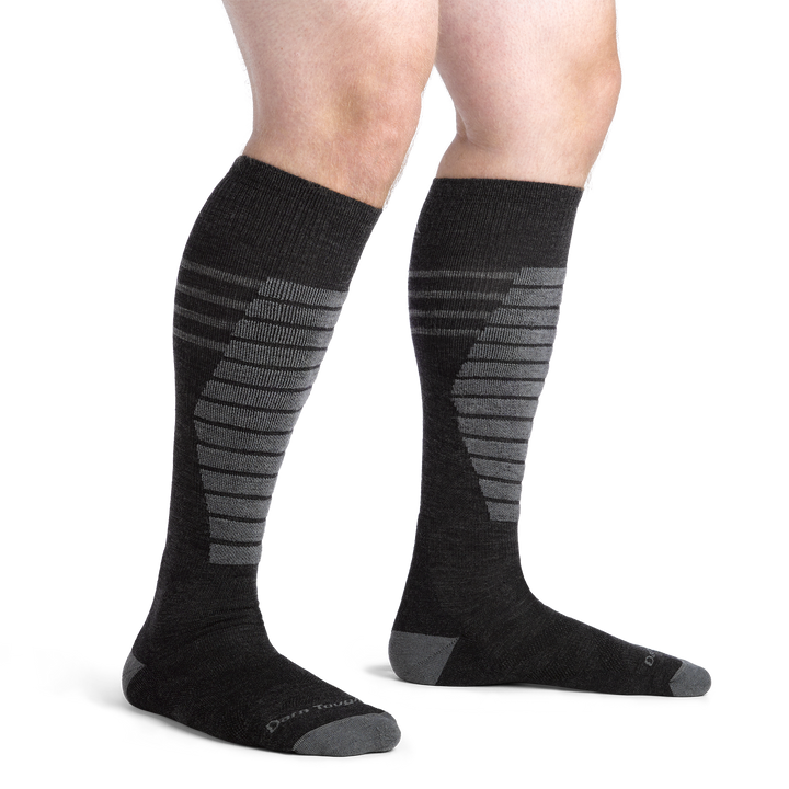 Close up studio shot of model wearing men's edge over-the-calf midweight ski & snowboard sock in Charcoal