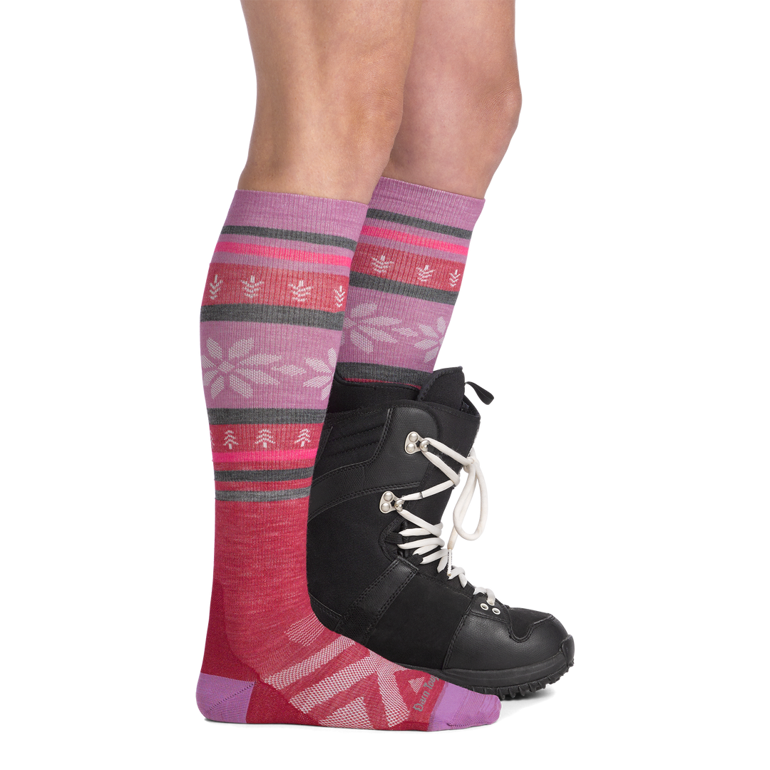 on model image side view back foot in boot wearing the 8021 alpine over the calf sock in cranberry colorway