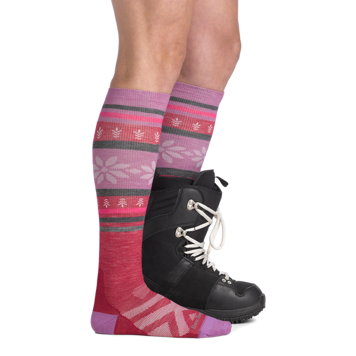 on model image side view back foot in boot wearing the 8021 alpine over the calf sock in cranberry colorway