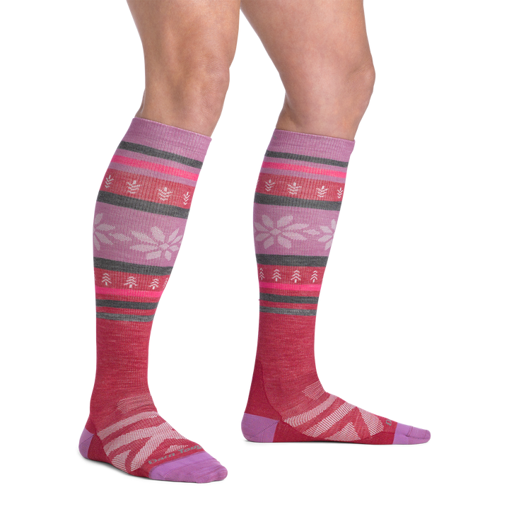 on model image bare foot wearing the 8021 alpine over the calf sock in cranberry colorway