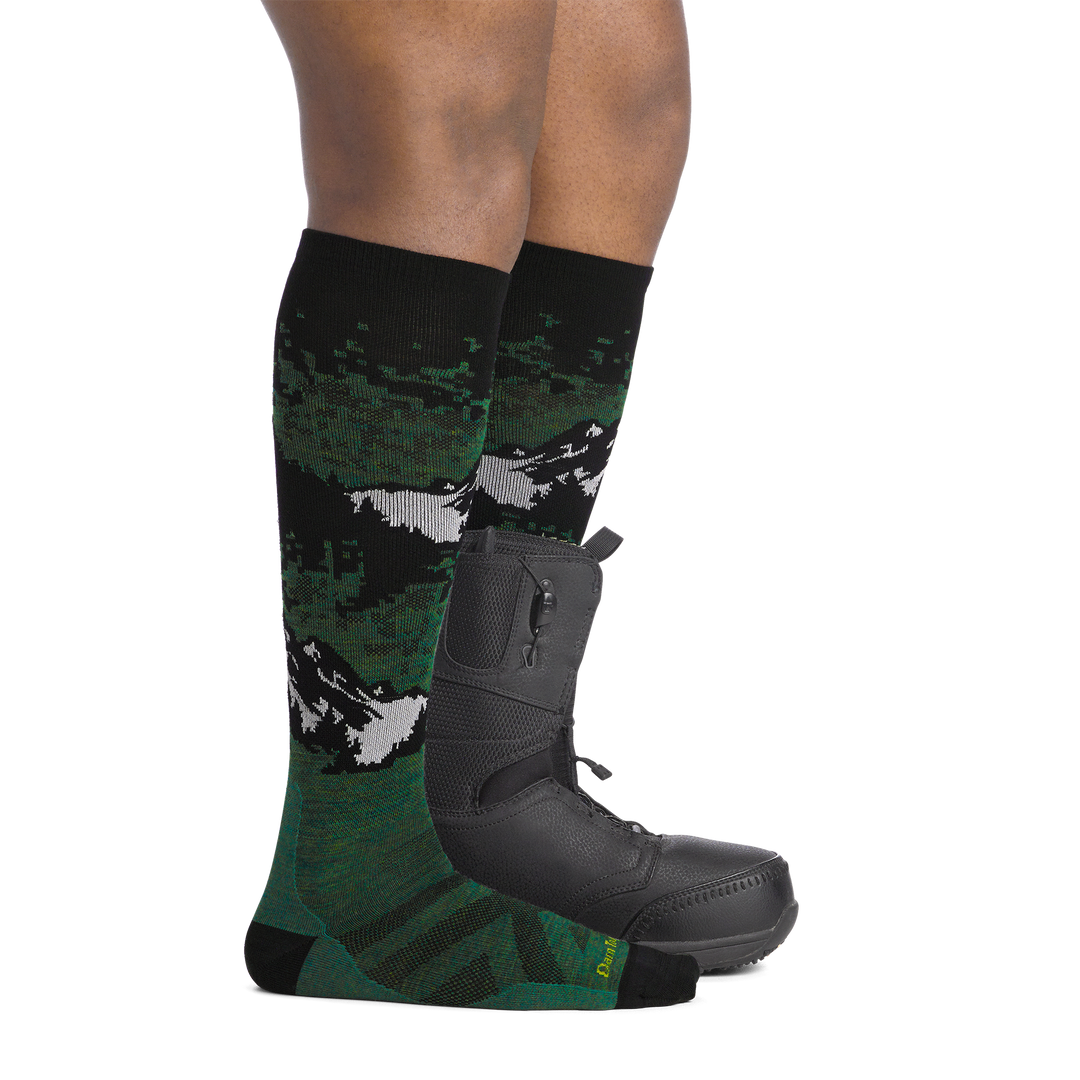 on model image side view back foot in boot6 wearing the 8051 cold smoke over the calf sock in moss colorway