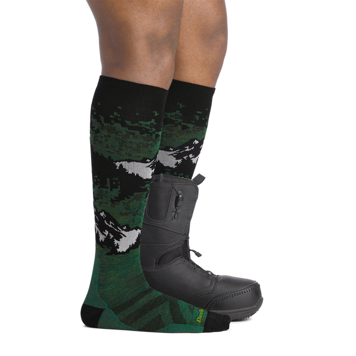 on model image side view back foot in boot6 wearing the 8051 cold smoke over the calf sock in moss colorway