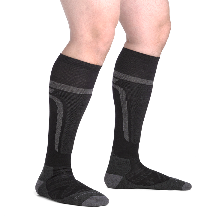 on model image bare foot wearing the 8053 edge over the calf sock in black colorway