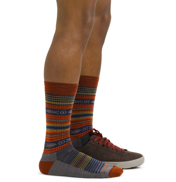 A pair of feet wearing cushioned socks with padding for ultimate comfort