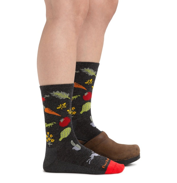 Pair of feet wearing our crew socks for everyday with a pair of clogs