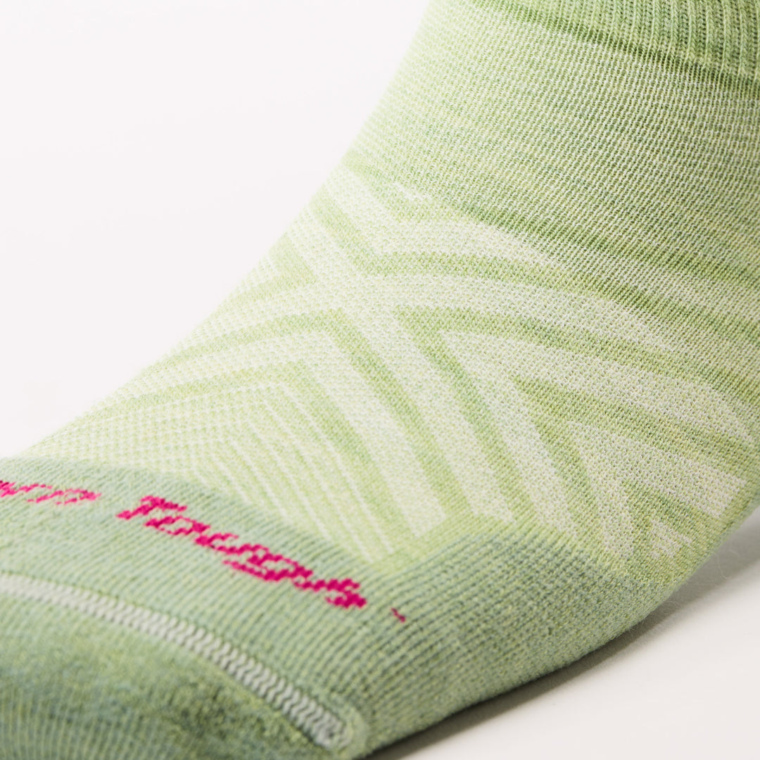close up of mesh forefoot with pink darn tough text on womens 1047 Run No Show Tab Ultra-Lightweight with Cushion in jade