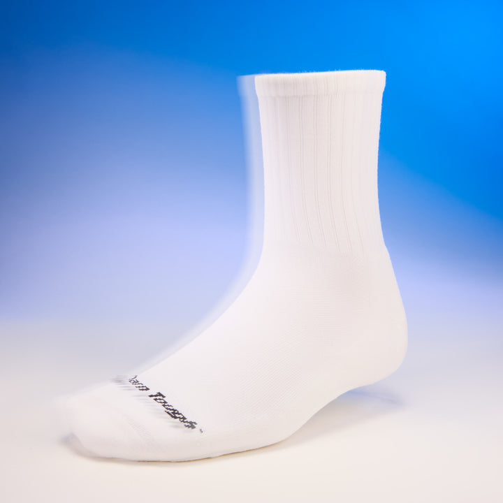 studio shot of mens 6157 the standard micro crew lightweight with cushion in white with blue background 
