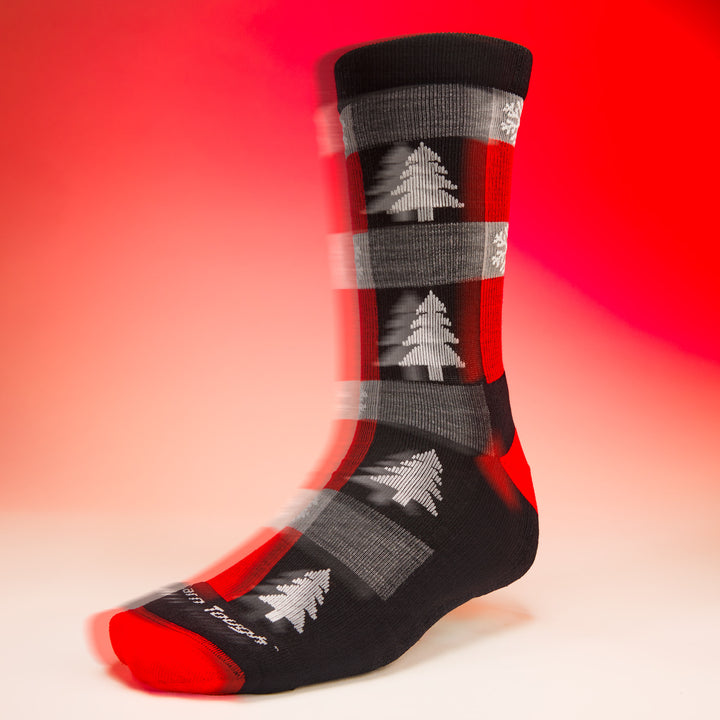 studio shot of unisex 6235 Festive Flannel Crew Lightweight Cushion coal with red background
