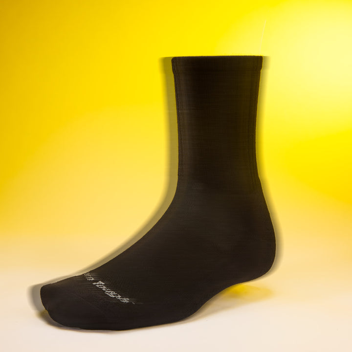 side profile studio shot of mens 6157 the standard micro crew lightweight with cushion in black with yellow background
