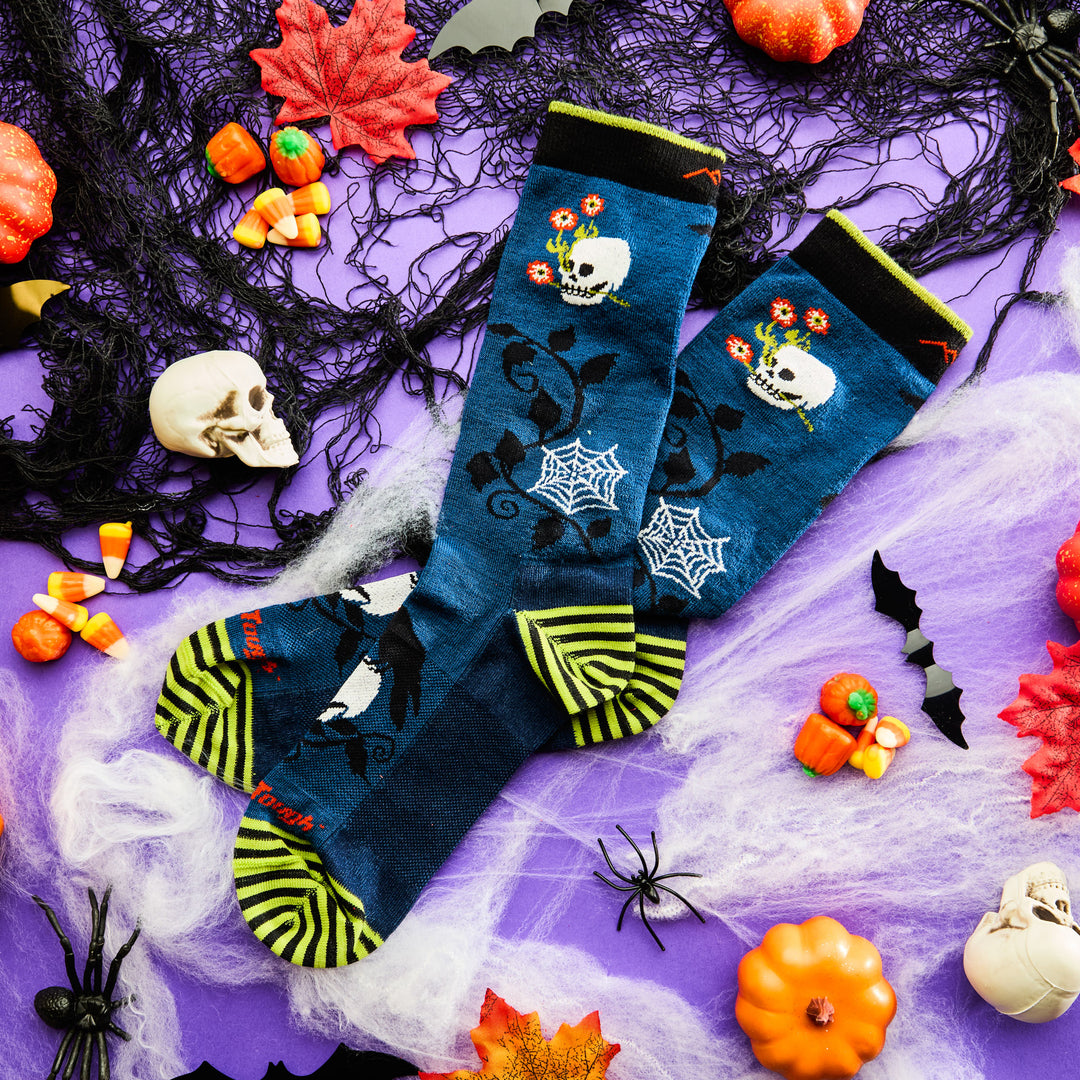 unisex 6233 Spooky Hollow Crew Lightweight in midnight laying flat on purple table surrounded by halloween decor