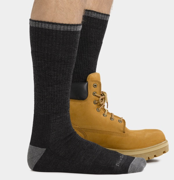 Man wearing work boot socks with work boo