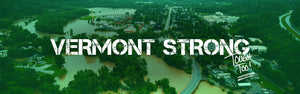 Vermont Strong, Tough Too! message over image of flooded town in Vermont