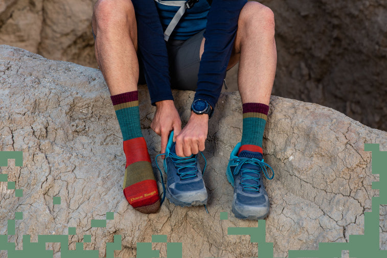 Shop our favorite hiking socks - feet wearing some good-looking socks with trail runners 