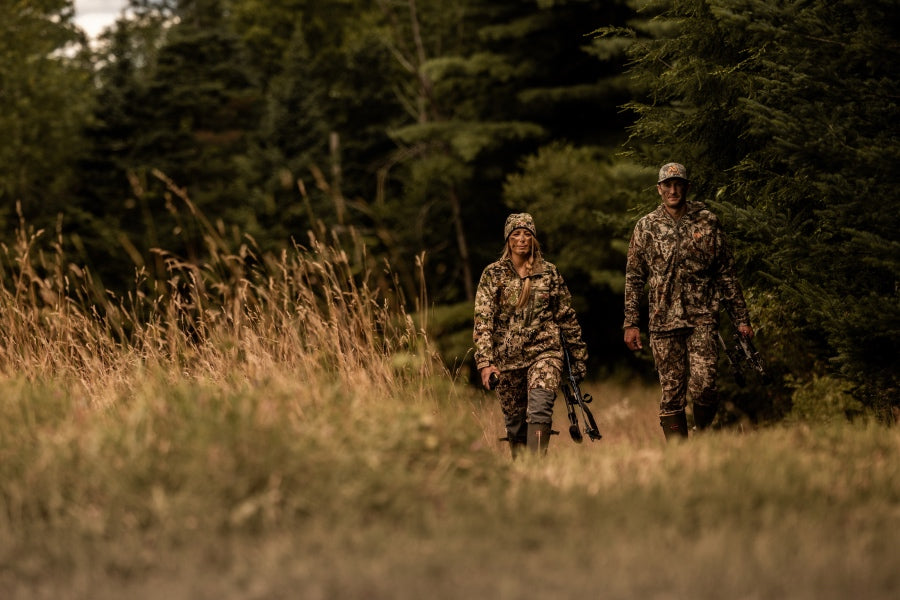 A husband and wife in camo headed out to go hunting