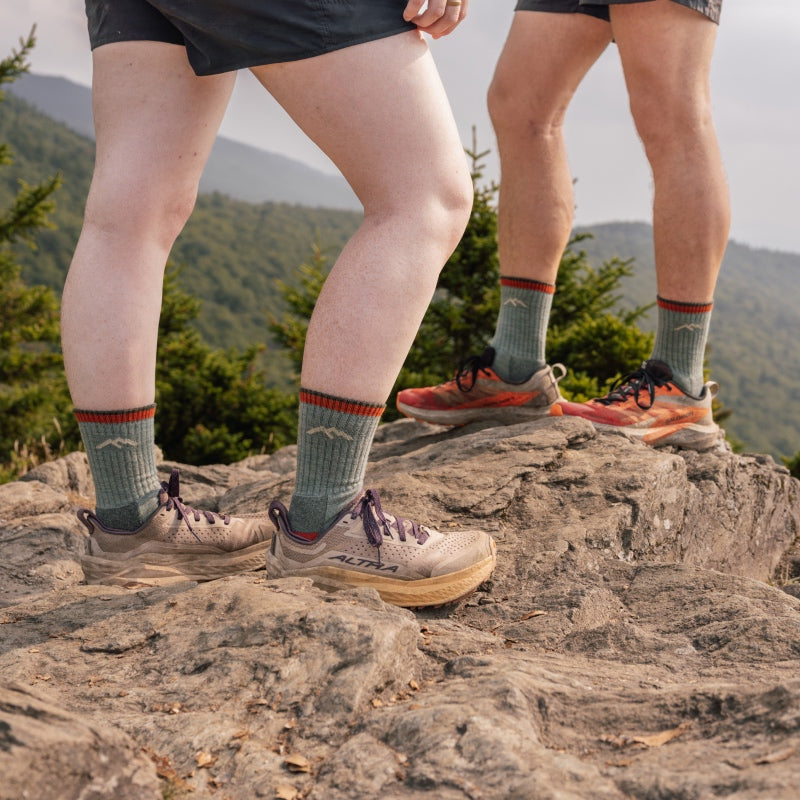 Two hikers standing on a summit wearing the 1466 hiker micro crew sock in matching colors