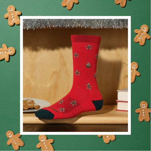 A bright red sock covered in tiny gingerbread men - perfect for gifting