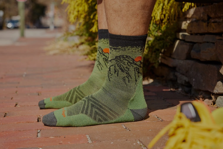 Shop Darn Tough Sock Gifts Under $25 - feet socks with a mountain design