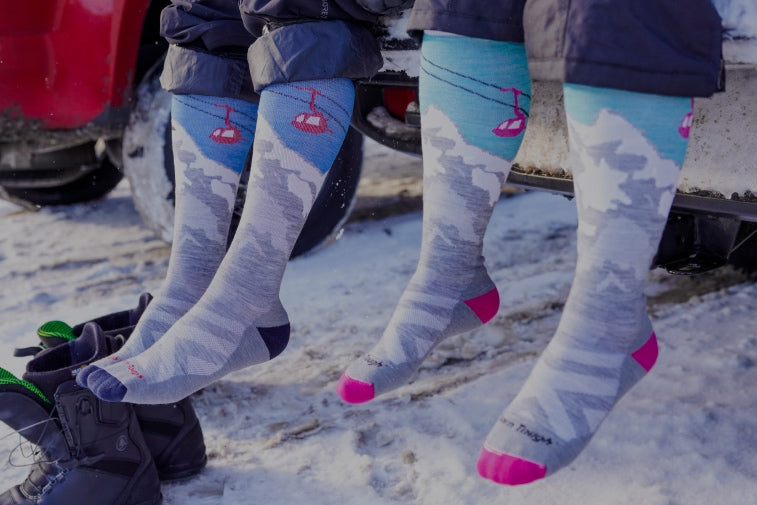 Shop Sock Gifts Under $50 - feet wearing matching ski socks