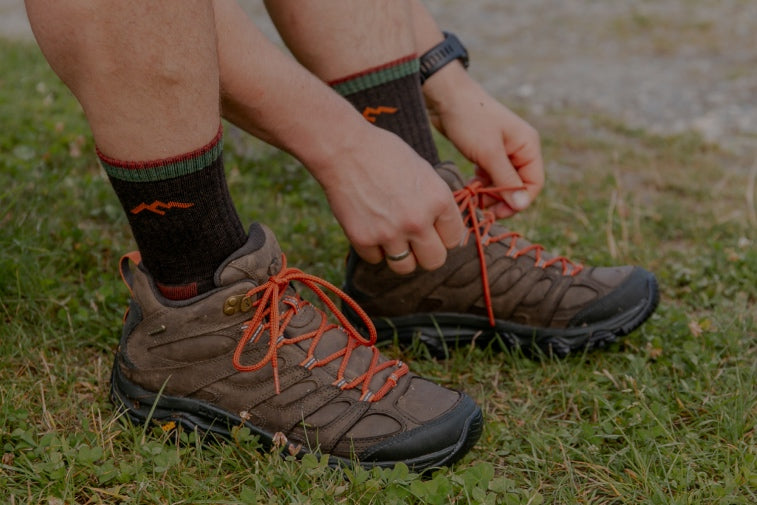 Shop Gifts for Men - feet wearing hiking boots and hiking socks, a great gift for guys