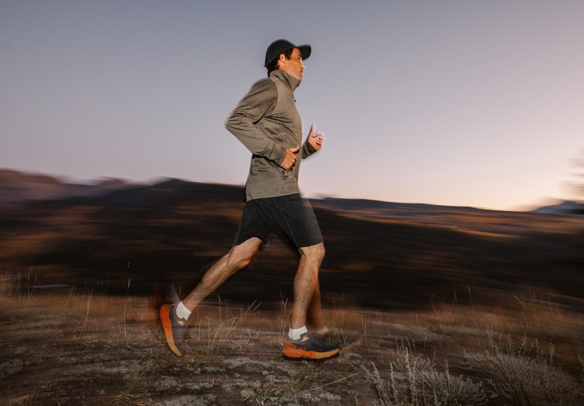 Shop Men's Running Socks - man out trail running wearing Darn Tough run socks