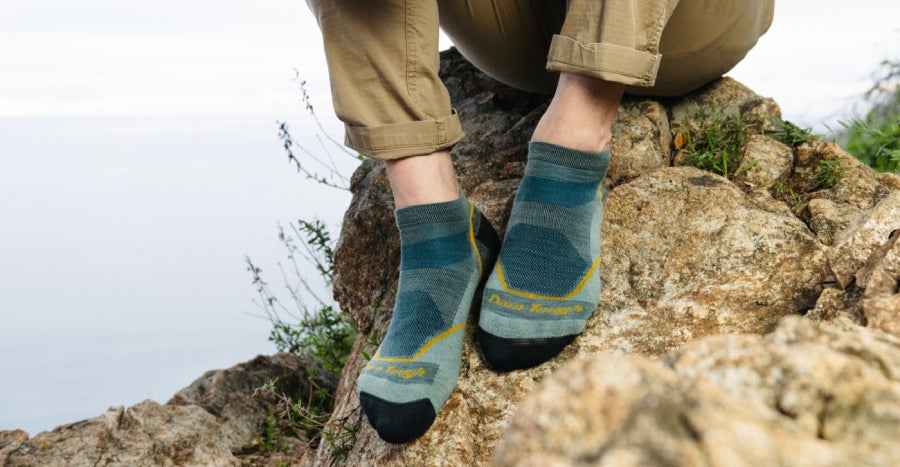 Feet wearing no show height hiking socks from Darn Tough