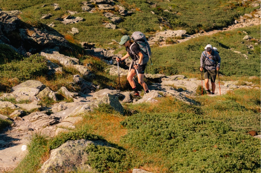 Two hikers headed up Mt. Mansield in Vermont wearing the 1466