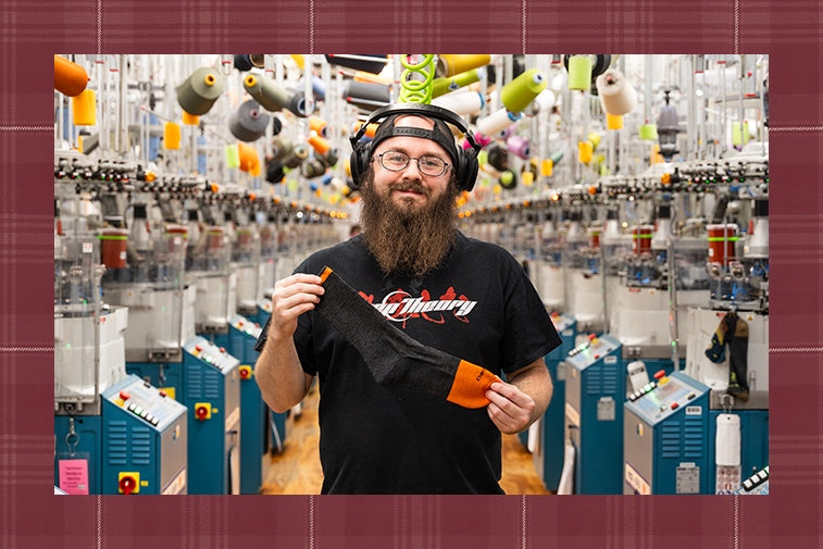 Gregory at the Mill holding the Steely sock