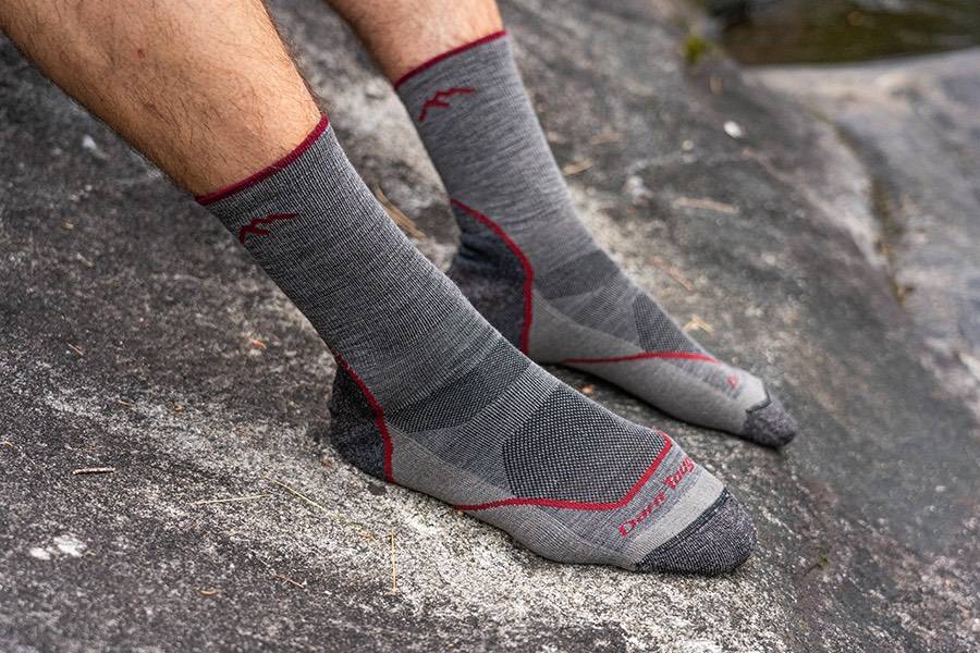 Feet wearing Light Hiker lightweight hiking socks in gray, the best socks for hiking in summer